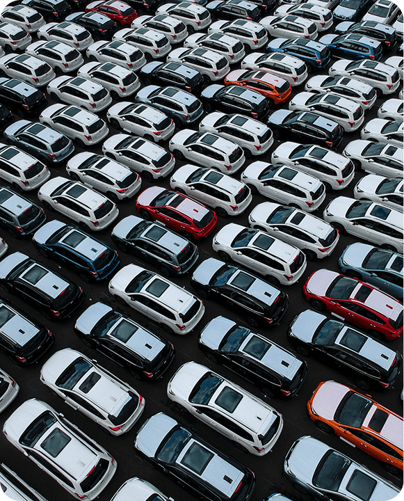Rows of parked cars, aerial view.